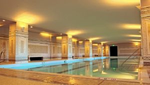 The pool deck and walls in the spa area were installed with mosaic tiles, and larger tiles in the treatment rooms.