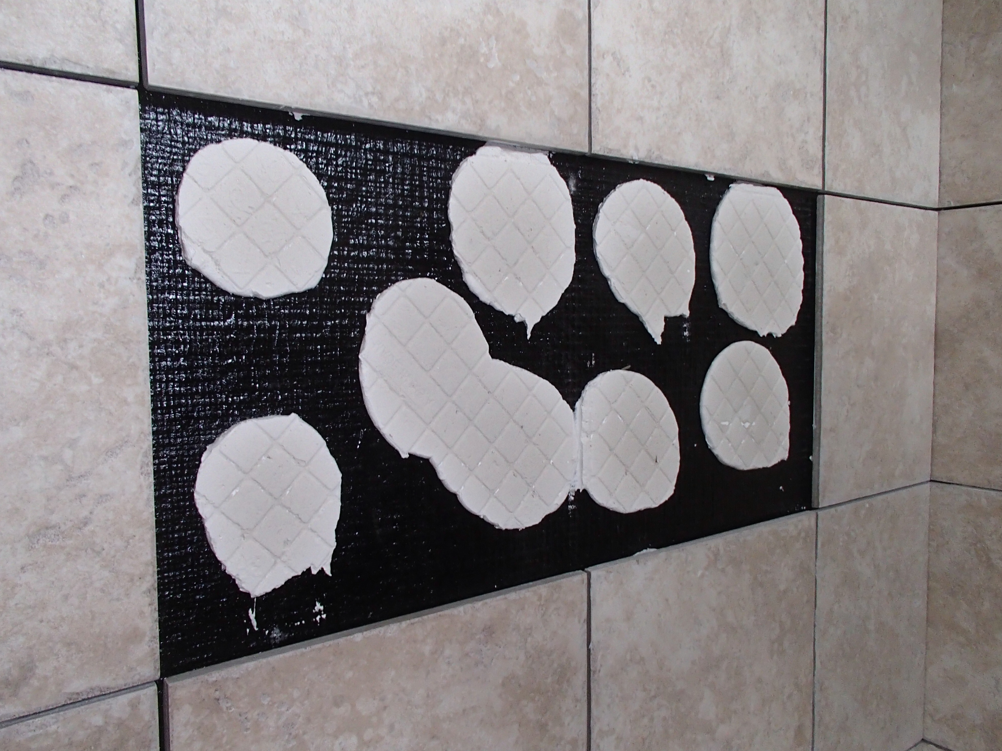 Tile & Shower Failures A closer look a spot setting tile. Why this is