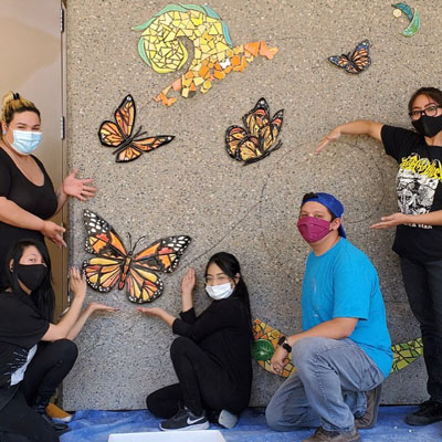 (U.l. to r.) Vanessa Alvarado (Lead Artist), Tori Lucero (Lead Apprentice), Jai Salazar (Apprentice), Atom Vigil (Apprentice) and Jacquelyn Yepa (Apprentice). Members of the team not pictured are Jaqueline De La Cruz (Lead Apprentice), Margarita Paz-Pedro (Lead Artist) and Cassandra Reid (Lead Artist).