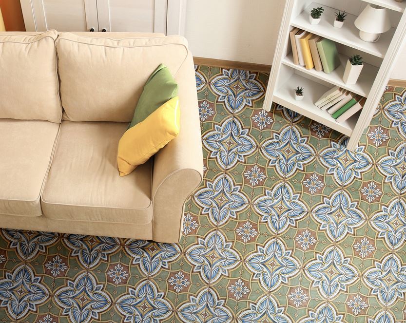 Couch and bookcase on green and blue tile