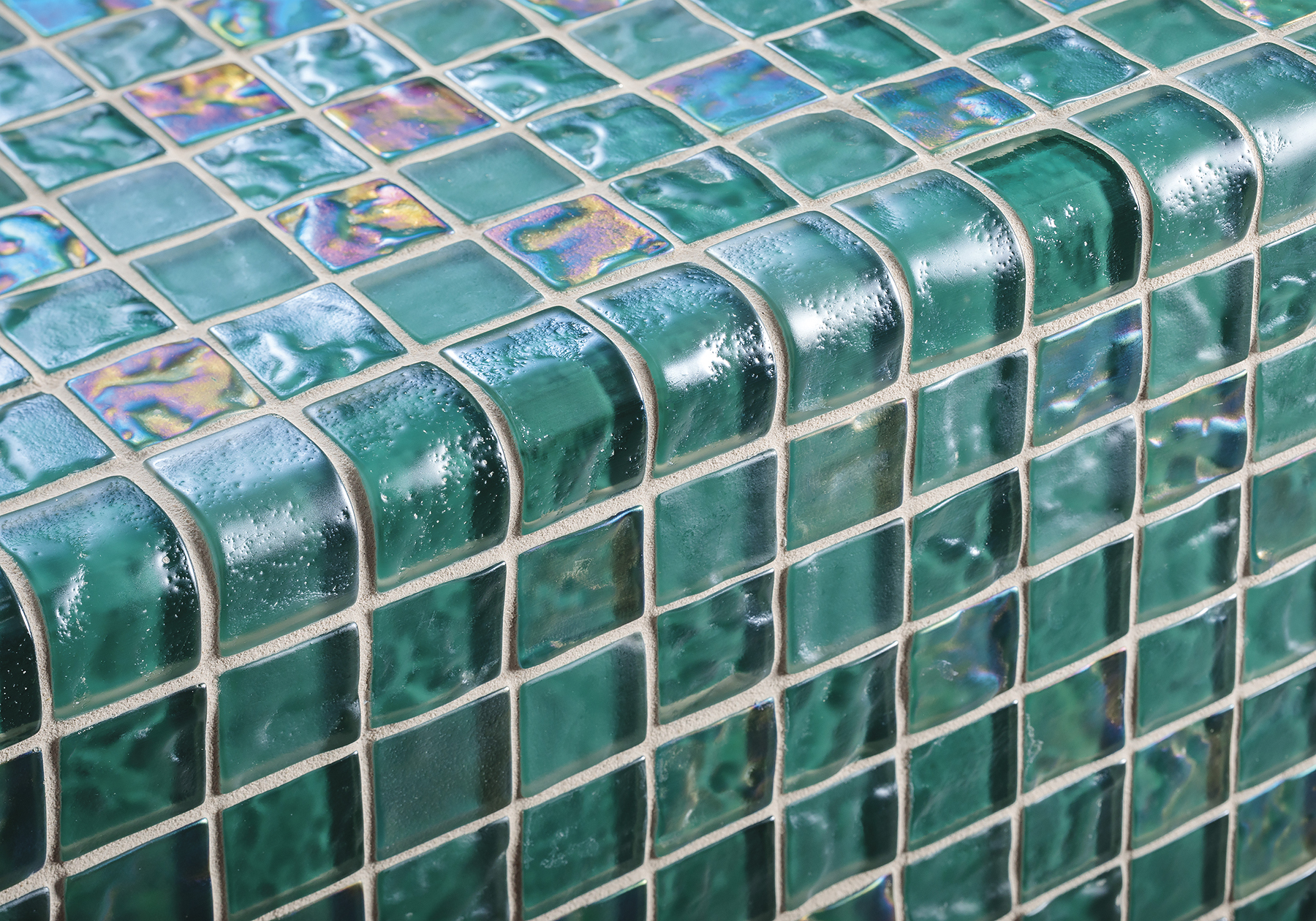 Island Stone's Lava Glass mosaics offer durable, fused glass tiles with iridescent and undulating accents - TileLetter Island Stone's Lava Glass mosaics offer durable, fused glass tiles with iridescent and undulating accents - TileLetter