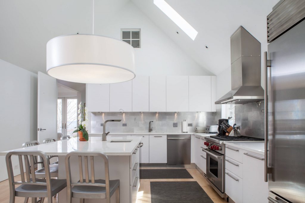white kitchen with tile backsplash