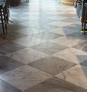 Significant floor preparation was needed to get this 24"x24" tile installed with no lippage.