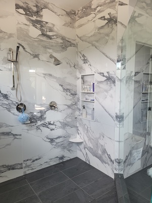 A shower tiled with 36"x72" tiles requires that a flat substrate be created before the tile is installed.