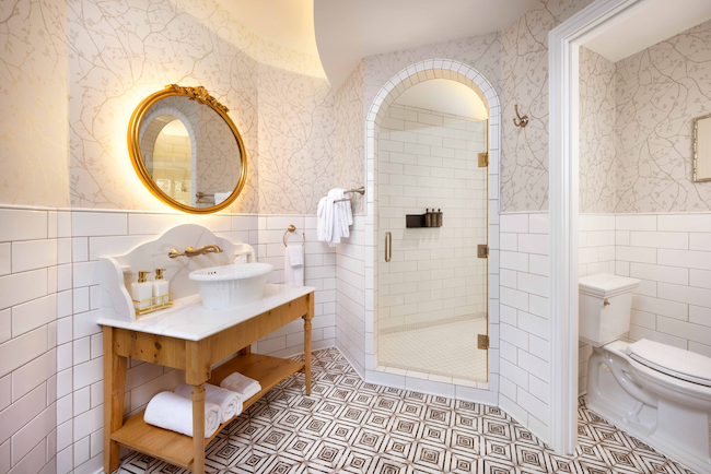 Precision, subway tile, 2.25" shower floor tile and Vivace room tile meld the vintage feel of the room with a modern twist.