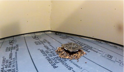 Use of a positive weep protector instead of pea gravel would ensure protection of weep holes.
